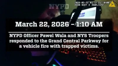 פאליציי אין קווינס ראטעווען מענטשן פון א ברענעדיגע קאר