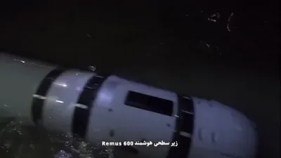 שפאנונגען ביים הארמוז: די איראנער רעוואלוציאנערע גווארדיע מעלדט אז זיי האבן נאכאמאל פארכאפט א פארגעשריטענע אמעריקאנער שפיאנאזש סובמארין