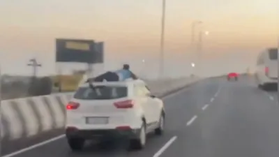 שמוגלער געכאפט לייוו: א העלדישער פאליציאנט האלט זיך אן אויפן דאך פון א קאר דורכאויס א ווילדע 25 מייל טשעיס