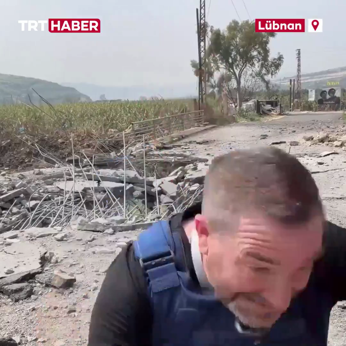 א דזשורנאליסט און קעמערא מאן פאר די רוסישע נייעס א