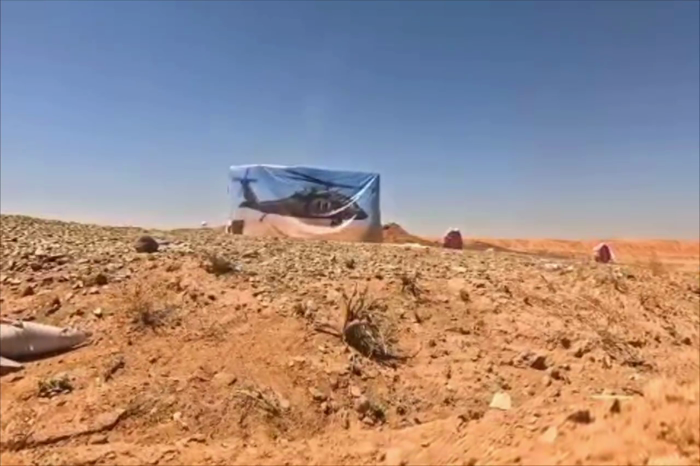 איראנער זעלנער טרענירן זיך צו שיסן און פארניכטן אן